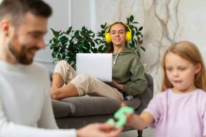 front-view-smiley-parents-kid_23-2150172036